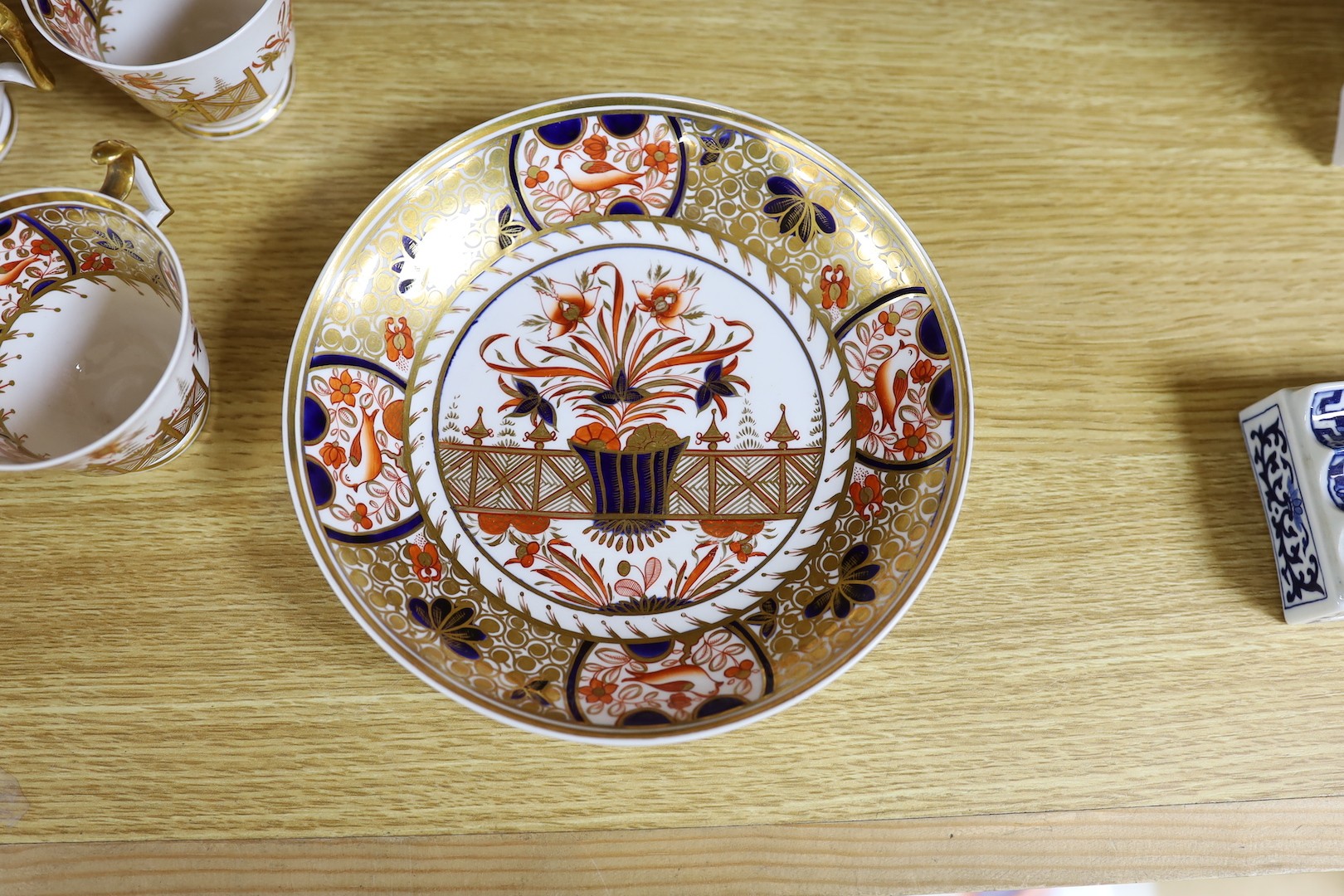 A Spode part Imari tea service consisting of six London shape tea cups, coffee cups and saucers, two graduated saucer dishes and a bowl pattern 1495